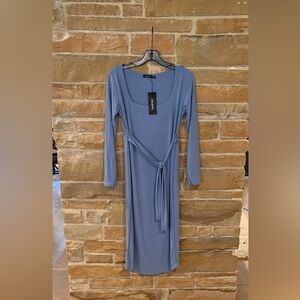 New dress with tags.  Could be worn for maternity. Stretch fabric.